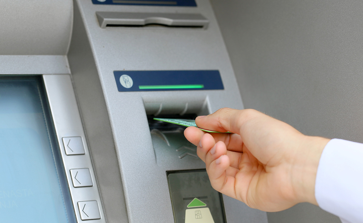 Man using ATM
