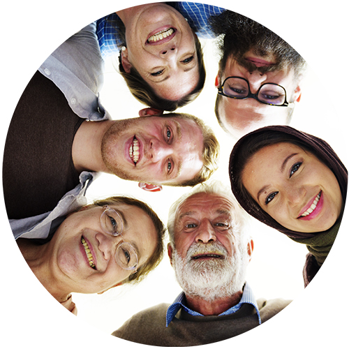 Multicultural group of men and women in a circle and smiling.
