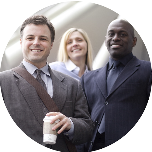 Two businessmen and one businesswoman smiling.